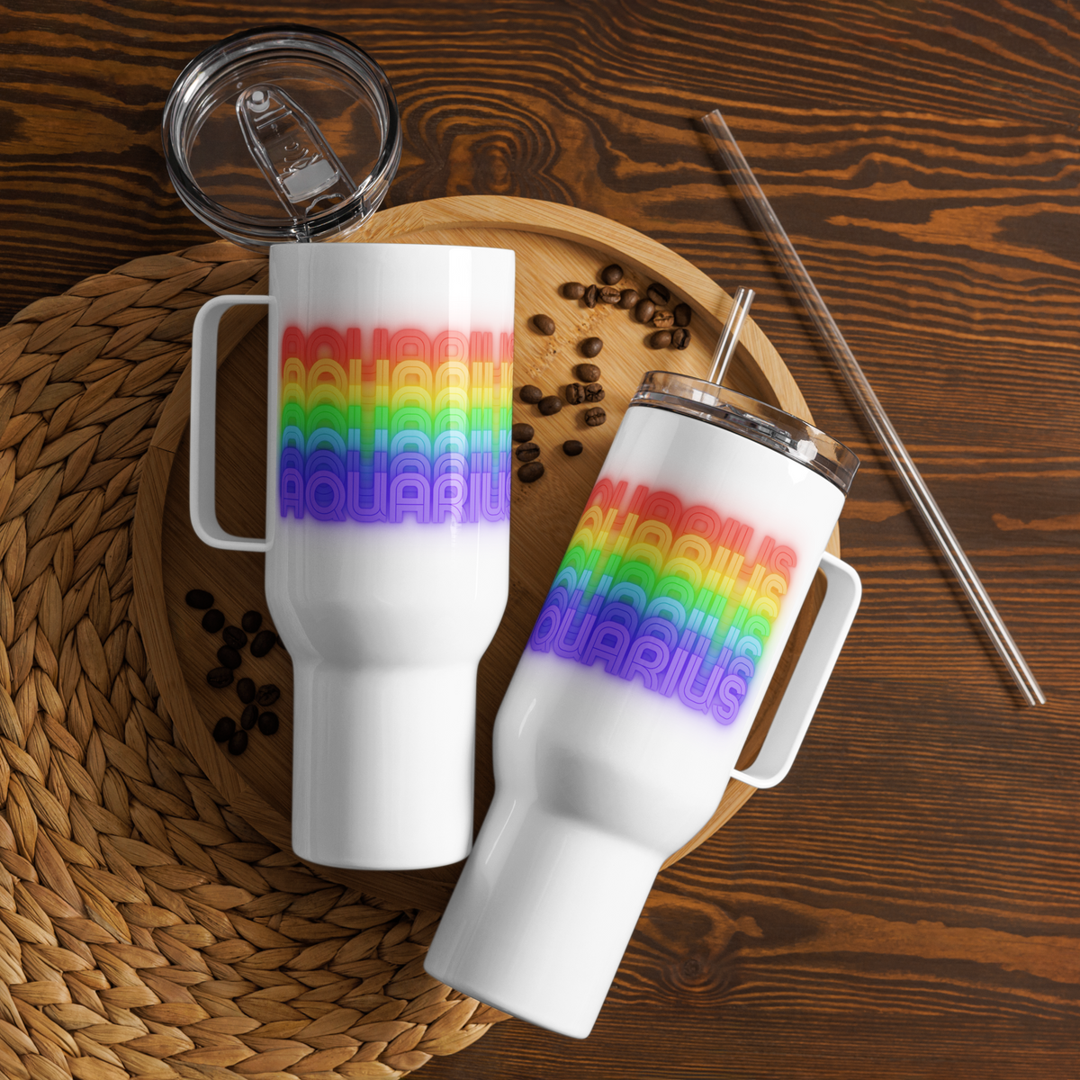 Two Aquarius Rainbow White Travel-Mug-with-Handle-40-oz on a wooden surface with coffee beans and straws.